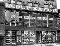 Exterior of Store 1, 16 - 20 Goose Gate, Nottingham. With 'Boot & Co Ltd Drug Stores' fascia and a window display made up of one product only – Seltzogenes, c1885. [CAIS 524]