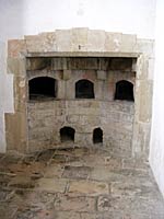 Bread Ovens at the Little Castle, Bolsover: A fire would be made within each oven and then removed once the oven was hot enough. The oven could then be used for baking for several hours. These ovens like those in most other large houses were located in a separate room from the kitchen.